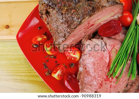 beef barbecue served on big red dish