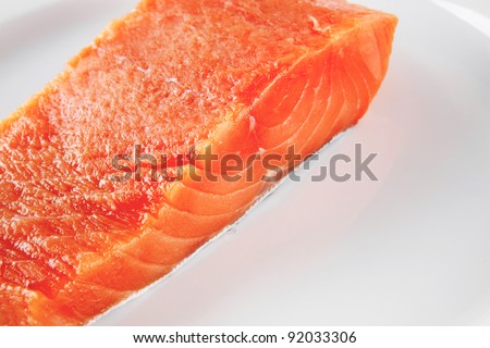 smoked pink salmon chunk on a big white dish