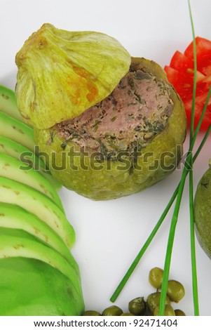 meat meal: round zucchini filled with mince meat over white dish