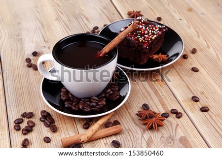 dessert : hot black coffee and chocolate cake with cinnamon , coffee beans, and anise star