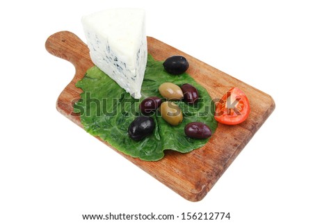 blue mold cheese on wooden platter with olives and tomato isolated over white background