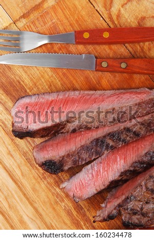 holiday dinner meat food : roast beef steak on wood plate isolate on white background