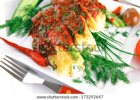 cheese cannelloni served with vegetables on square plate