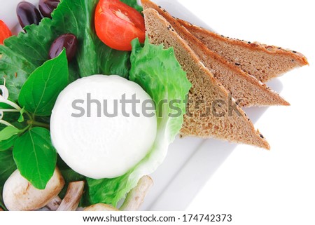 white cheese and bread with olives and tomatoes