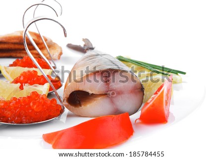 diet food - red caviar and smoked mackerel fish with lemon tomatoes and bread on white china plate isolated over white background