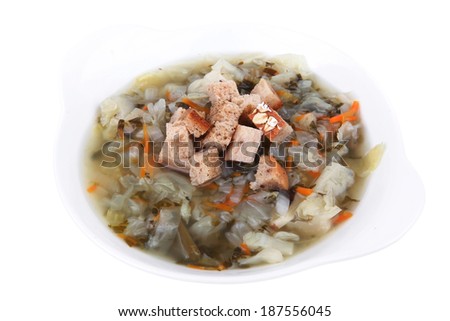 diet food : vegetable soup with bread  crackers in white bowl isolated over white background