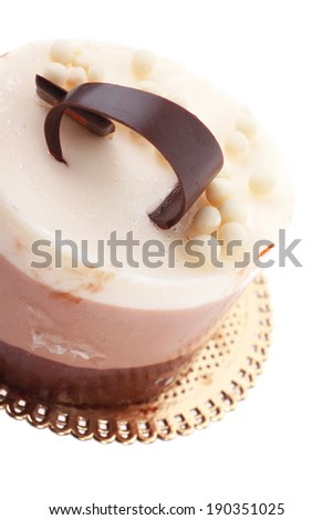 sweet pie layered chocolate milk cake with chocolate on top isolated over white background