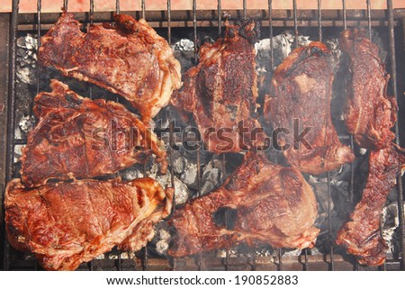 fresh hot bbq grill red beef meat steak ready on grid over charcoal with marks