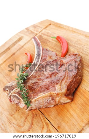 savory : grilled spare rib on wooden plate with thyme isolated over white background