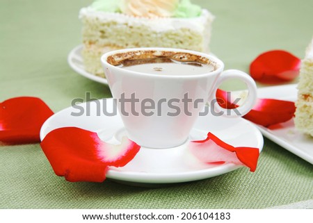 sweet breakfast : whipped cream cake with roses and hot black coffee
