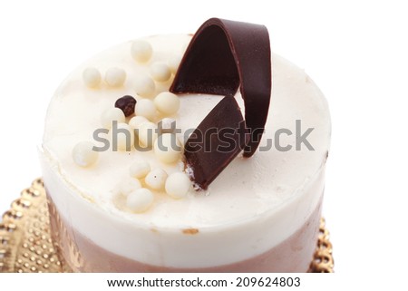 sweet pie layered chocolate milk cake with chocolate on top isolated over white background