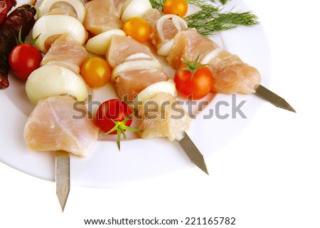 raw fresh chicken shish kebab on white plate
