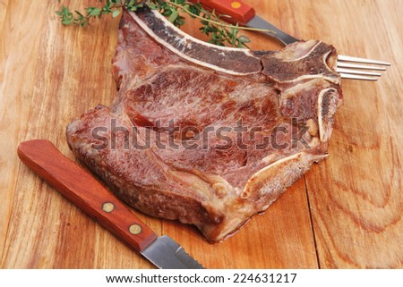 savory : grilled spare rib on wooden plate with thyme