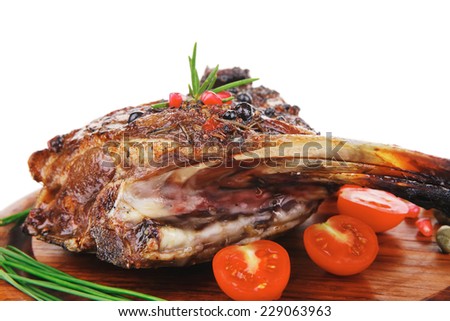 ribs on wooden plate over white background