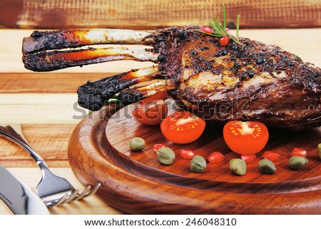 ribs rack on wood with stainless steel cutlery