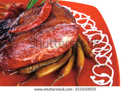 main meat course on red plate with vegetables