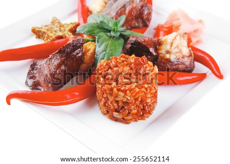 meat main course served on white plate over white
