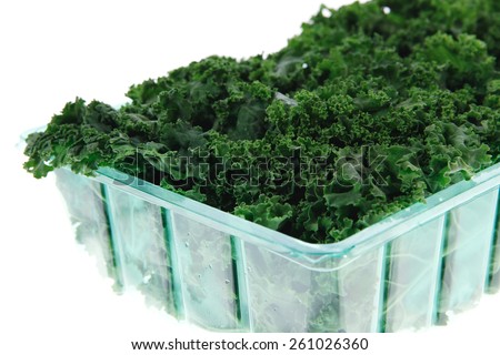 fresh raw green kale packed in plastic box ready to sell isolated over white background