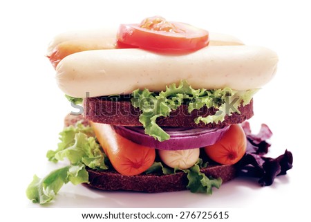 fresh beef meat sausage sandwich with green salad and tomatoes isolated on white background