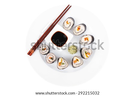 Japanese Cuisine : Sushi Maki Roll with Salmon and tuna inside . on white dish with sticks isolated over white background