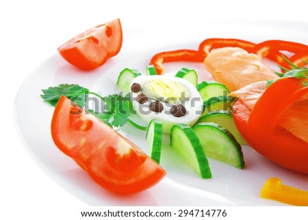 diet healthy food - fresh smoked sea salmon rolls with tomatoes egg and resemary on plate isolated over white background