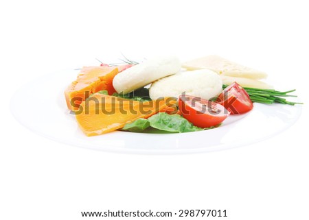 aged cheese : parmesan roquefort and gruyere chops delicatessen cheeses and soft feta on plate isolated over white background