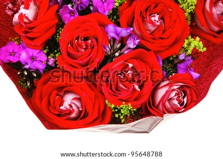 flowers : big bouquet of rose and pansy flowers with green grass in red wrapping papper isolated over white background