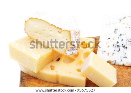 edam parmesan and brie cheese on wooden platter isolated on white background
