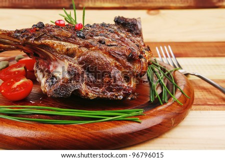 ribs rack on wood with stainless steel cutlery