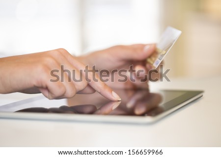 Close-Up Woman\'S Hands Holding A Credit Card And Using Tablet Pc For Online Shopping