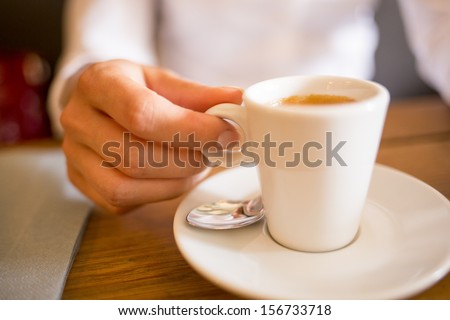 Woman drinking coffee in restaurant,cafe