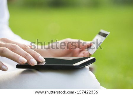 Close-Up Woman\'S Hands Holding A Credit Card And Using Cell Phone, Online Shopping, Outdoor