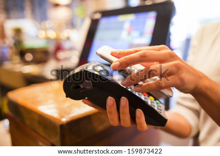 Woman Paying With Nfc Technology On Mobile Phone, Restaurant, Cafe, Bar