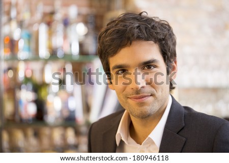 Portrait of handsome man in restaurant, looking camera