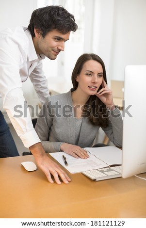 Business people at the office working on computer