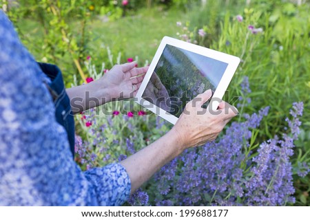 Woman senior using credit card and computer to shop on-line