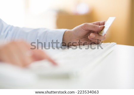 Woman is shopping on the internet with credit card