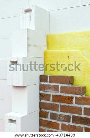 Thermal insulation of a brick wall at a construction site