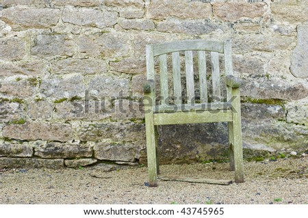 Rotten Chair In Front Of A Old Brick Wall Stock Photo 43745965