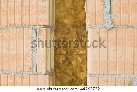 Thermal insulation of a house wall on a construction site