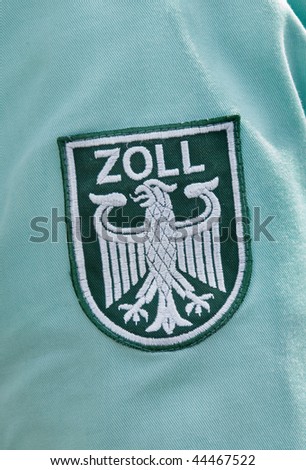 Label on the shirt of a german customs officer