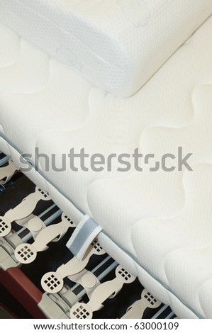 Slatted frame of a bed, mattress and pillow