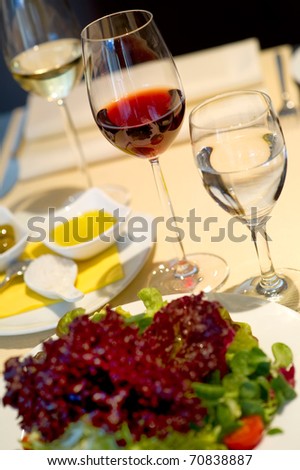 Covered dining table with wine glasses
