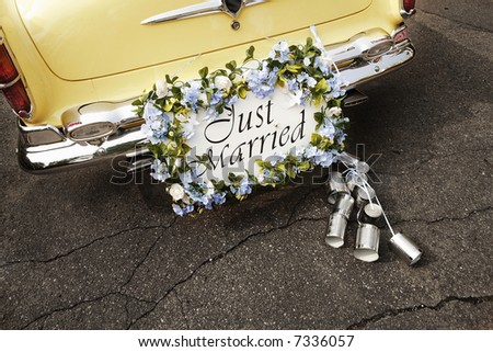 just married sign on bumper of vintage car
