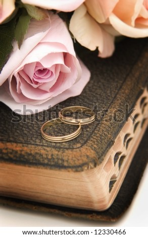 stock photo Wedding rings on Bible