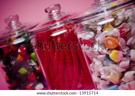 Saltwater taffy, licorice, and fruit flavored hard candy in glass containers