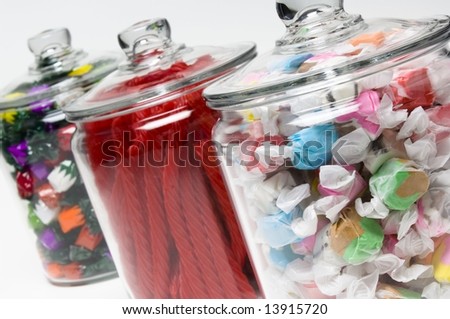 Saltwater taffy, licorice, and fruit flavored hard candy in glass containers