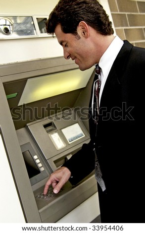 man at automatic teller machine