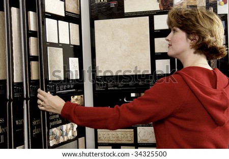 woman picking floor sample