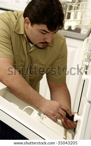 Man repairing dishwasher